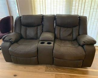 Leather and suede reclining double sofa with center console and cup holders