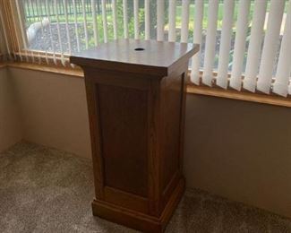 Wood podium approx 4 ft high and 18 in square