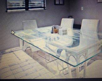 Glass top table with etched Sun. White metal frame $125. Chairs are not included already sold.