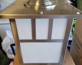 2 outdoor lamps. Tiffany glass stainless steel frame $125 each new in box paid $170 each.