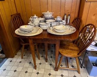 Walnut dining table w/4 leaves and 6 chairs. Chairs are not original to the table.