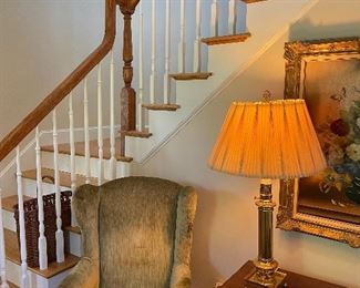 Antique green velvet Queen Anne chair with mahogany exposed arms, antique mahogany game table, vintage brass train car style table lamp with pleated shade.  (SOLD - Vintage oil on canvas, floral, gilded frame).