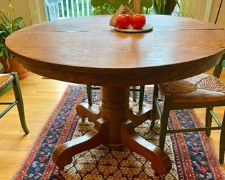 Oak pedestal table, c. 1910-20s.  (Rug not available). 