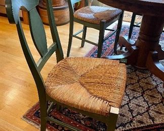 Set of 4 chairs, like new condition; rush seats, stained hardwood.