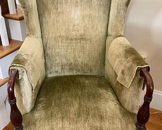 Queen Anne wing chair, green velvet vintage upholstery, exposed mahogany arms, late 19th century.