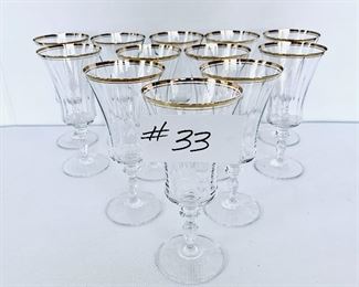 12 Gold rimmed crystal wine glasses. 
8”t.  $125