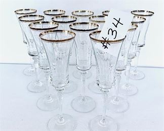 14- Gold rimmed champagne glasses.
 9”t. $145