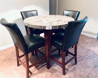 Round  Bistro table and four chairs. Table height 36 t.  40 w.  
Set. $195