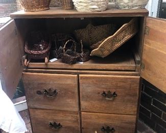 Storage unit with woven baskets of all shapes and sizes