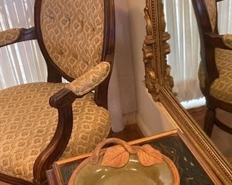 Interesting pottery bowl on an Asian table near one of the Louis XVI repro chairs