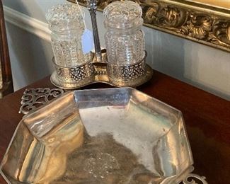 Many silver serving pieces