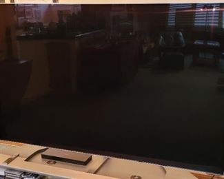   Large 75" Samsung TV with custom stand