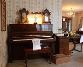 Upright Webber Piano in excellent condition, File cabinet to the right contains sheet music and will be included in the sale of the piano and piano seat
