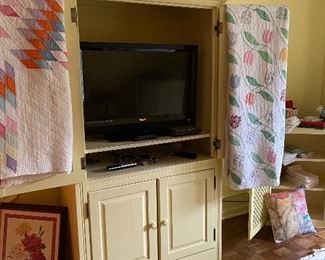 Antique quilts, cute painted TV cabinet