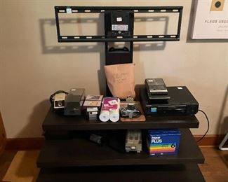 Great little tv stand for a flat screen and to go with your high tech tv, you totally need a state of the art VCR!  Can you even hook up a VCR to a new tv?  Are they compatible?  