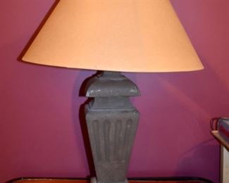 One of a pair of heavy iron lamps