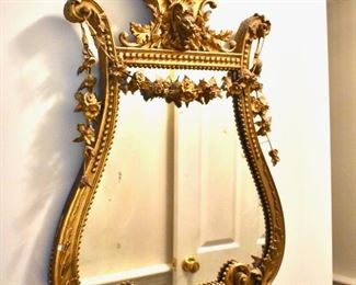 Antique gilt lyre-shaped mirror