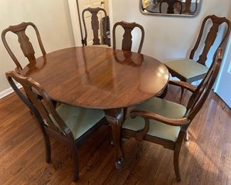 Formal dining table with three 10” leaves.  Table goes from 54” to 84” and is 42” deep.  6 dining chairs sold separately 