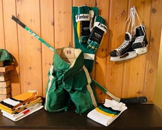 Vintage North Stars hockey gear, including a pair of Ferland hockey gloves worn by Murray Oliver when he was Assistant Coach of the North Stars