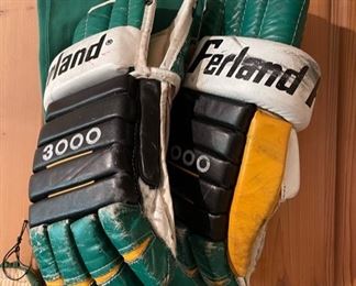 Vintage North Stars hockey gear, including a pair of Ferland hockey gloves worn by Murray Oliver when he was Assistant Coach of the North Stars
