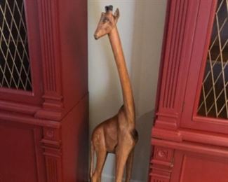 Wooden giraffe, base is cracked (climate related).  $50.     TWO (2) custom painted (burnt red) library cabinets with heavy metal inserts - very nice and beautifully made.  7’ tall, 4’ wide, 17” deep.  $650 EACH.  SOLD