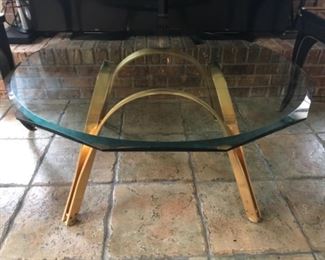 Modern coffee/occasional table, purchased at Hurwitz Mintz in New Orleans.  Heavy brass base and heavy beveled glass octagon top. (Purchased new for $2500).  $800.  NOW $250. 40” diameter, 18” tall