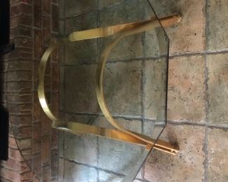 Modern coffee/occasional table, purchased at Hurwitz Mintz in New Orleans.  Heavy brass base and heavy beveled glass octagon top. (Purchased new for $2500).  NOW $250.  40” diameter, 18” tall