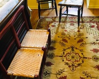 many fine old rugs, and two Hitchcock chairs
