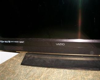 one of two flat screen tVs