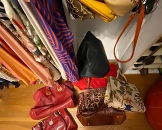 Several purses. Various styles and sizes.