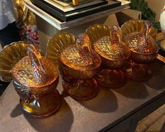 Set of four glass turkey compotes. Amber colored.
