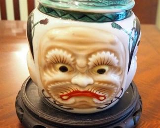 Hand Painted Banko Ware Five Face Jar With Lid On Carved Wood Stand, 6.5" Tall