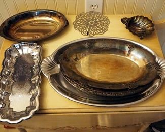 Silver Plate Servin Dishes Including Chafing Dish, Serving Platters, Flatware, Trays, And More