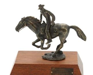 1014
Wah Ming Chang
1917-2003, Chinese/American
"Pony Express"
Patinated bronze on wood base
Edition no. 159; signed: WC; titled and with facsimile signature on bronze plaque; base further marked: Calhoun's Collectors Society / Bronze / CW / CH / 159
4" H x 4.875" W x 1.5" D
Estimate: $300 - $500