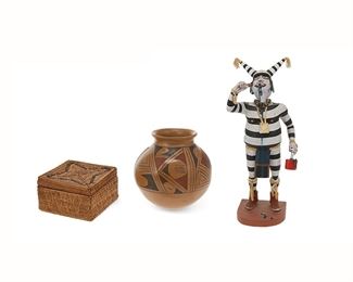 1015
A Group Of Three Southwest Native American Items
20th/21st Century
Pottery signed: Ben Villa; Kachina signed: H. Shelton / Oraibi, Ariz.
Comprising a polychromed carved wood "Koshare" kachina by Henry Shelton (b. 1929, Hopi) (17.75" H x 7.5" W x 6" D), a flared rim jar with polychrome motif on buff burnished slip glaze by Ben Villa (20th-21st Century, Casa Grande) (7.5" H x 7" Dia.), and a square polychrome basketry box (3.5" H x 6" W x 6" D), 3 pieces
Estimate: $300 - $500