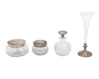 1025
Four American Brilliant Cut Glass And Sterling Silver Table Items
Late 19th/early 20th Century
Each marked for sterling; Two marked for Shreve & Co; One marked for Gorham
Comprising a trumpet vase, a flacon perfume bottle, and two covered powder jars, 4 pieces
Larger: 9.875" H x 3.5" Dia.; Smaller: 2.75" H x 3.875" Dia.
62.325 gross oz. troy approximately
Estimate: $200 - $400