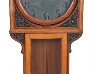 1038
An English Pub Wall Clock
Second-half 19th Century
Pewter dial with black Arabic hour markers, sub-second dial embellished with decoration, single train movement, within a carved oak case
53" H x 23.5" W x 8.25" D; Dial: 17.5" Dia.
Estimate: $500 - $700