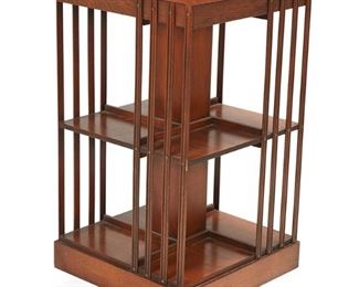 1048
An Arts And Crafts Revolving Bookstand
First-quarter 20th Century
A square pivoting two-tier bookstand with inlaid marquetry floral roundel to top
33.5" H x 17.75" W x 17.75" D
Estimate: $600 - $800