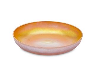1052
A Durand Art Glass Bowl
Circa 1924-1931; Millville, New Jersey
Signed: Durand
The low bowl of gold iridescent glass
1.375" H x 6.875" Dia.
Estimate: $100 - $200