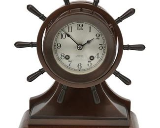 1061
A Chelsea Ship's Bell Clock
20th Century
Dial marked: Chelsea / Ship's Bell
The mantel clock with a silvered metal dial with black Arabic numeral hour markers and outer minute track, with 8-day two train movement, enclosed in a hinged bezel set in a brass and mahogany case
10.25" H x 8.25" W x 4.5" D
Estimate: $500 - $700