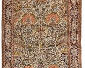 1064
An Iranian Area Rug
20th Century
Silk on silk foundation, the prayer-style design with polychrome floral and avian motifs bordered by text
109" L x 72" W
Estimate: $1,000 - $1,500