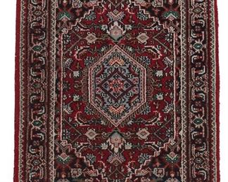 1067
A Small Kashan Rug
20th/21st Century
Wool on cotton foundation, with polychrome foliate motifs centering a pendant medallion on an ivory field within a charcoal palmette and vine border
40" L x 24" W
Estimate: $200 - $400
