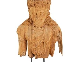 1068
An Indonesian Carved Wood Deity
Second-half 20th Century
Mounted on a black painted wood base
42.5" H x 30" W x 12" D
Estimate: $600 - $900