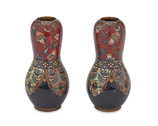 1070
A Pair Of Japanese Cloisonné Gourd Vases
Meiji Period (1868-1912)
Each: enamel cloisonne gourd vase with brass rim and base, decorated with polychrome avian and floral motifs on a red and dark blue ground, 2 pieces
Each: 6" H x 3" Dia.
Estimate: $200 - $400