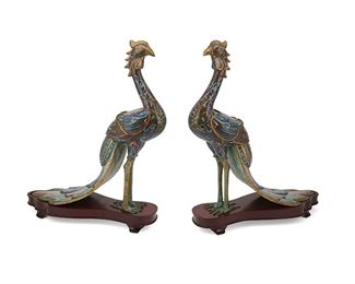 1072
A Pair Of Chinese Cloisonné Peacock Vessels
Late Qing Period (1644-1912)
Each brass peacock figural jar with polychrome cloisonne enamel decoration, removable wings revealing a compartment, and raised on wood stand, 2 pieces
15.75" H x 4.75" W x 13" D
Estimate: $500 - $700