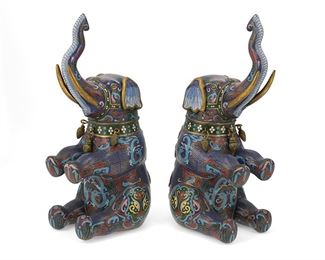 1073
A Pair Of Chinese Cloisonné Elephant Vessels
Late Qing Period (1644-1912)
Each brass elephant figural jar with polychrome cloisonne enamel decoration and a removable head revealing a lidded compartment, 2 pieces
12.25" H x 4.75" W x 5.5" D
Estimate: $500 - $700