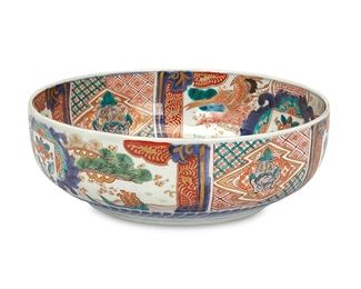 1075
A Chinese Imari Porcelain Bowl
First-half 20th Century
The circular Imari ware bowl with snapping turtle and frog motifs, geometric patterning, and blue underglaze with polychrome enamel overglaze and gilt rim
4" H x 12" Dia.
Estimate: $300 - $500