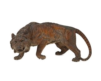 1079
A Cold-Painted Metal Tiger
Late 19th/early 20th Century
Unmarked
Possibly spelter, in the form of a prowling tiger
5.625" H x 12.75" W x 5.5" D
Estimate: $200 - $400