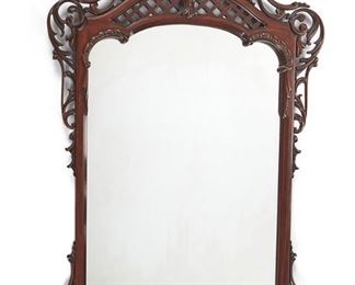 1096
A French Louis XV-Style Wall Mirror
Second-half 19th Century
The elaborately carved mahogany frame with reticulated crest and scrolling foliage enclosing a conformingly shaped mirror
46.5" H x 30" W x 1.75" D
Estimate: $400 - $600