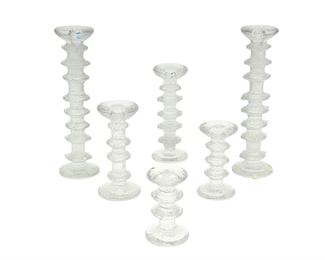 1129
Six "Festivo" Glass Candlesticks By Timo Sarpaneva For Iittala Of Finland
Circa 1960s-70s
Two with etched mark: TS; Each with Iittala factory labels
Each molded glass with ice-motif texture, 6 pieces
Larger: 12.5" H x 3.5" Dia.; Smaller: 4.875" H x 3.125" Dia.
Estimate: $300 - $400